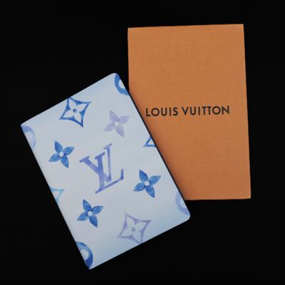 a louis vuitton notebook with a blue and white pattern on it