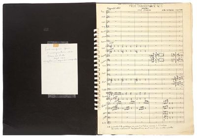 an open notebook with music notes and a notepad on it