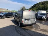 a silver van that is parked in a parking lot
