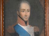 portrait d'un homme en uniforme, portant une écharpe bleue, dans un cadre en bois