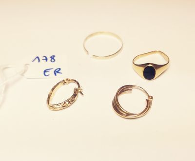 three rings and a ring with a blue stone on it