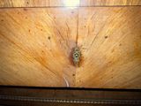 a close up of a wooden table with a drawer on it