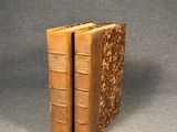 an image of two old books sitting on top of each other