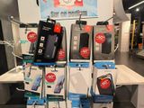 a lot of cell phones on display in a store