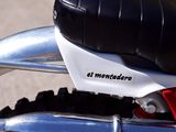 a close up of a motorcycle parked on the side of the road