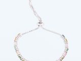 a necklace with multi colored stones on a white background