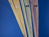 three different colored ties on a blue background