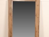 an image of a large mirror sitting on top of a wooden floor