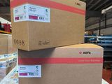 two boxes are stacked on top of each other in a warehouse