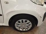 a white car that is parked in a garage