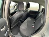 the interior of a car with the door open and the seats down