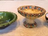 three bowls sitting on a table next to each other