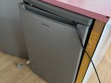 a picture of a kitchen with a pink counter top and silver appliances