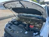 a car with its hood open and the engine in it