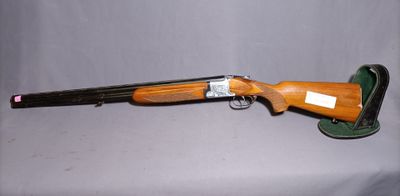 an old shotgun with a wooden barrel and a leather case