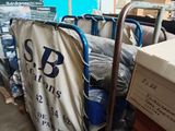 a cart full of bags and boxes in a warehouse
