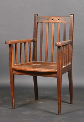 a wooden chair with a wooden seat on a gray background