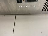 an image of a machine that is sitting on a tile floor