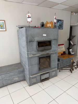 a kitchen with a stove, oven, and table in it
