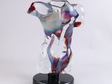 an image of a glass vase on a black stand