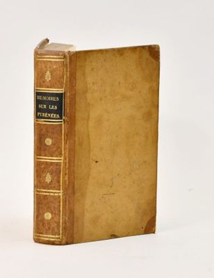 an old book sitting on top of a table next to a white background