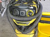 a yellow and black vacuum and a yellow case