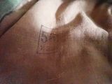 a close up picture of a piece of cloth with a tag on it