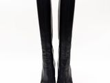 a pair of black leather boots on a white background