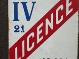 a sign on the door of a building that says iv licence