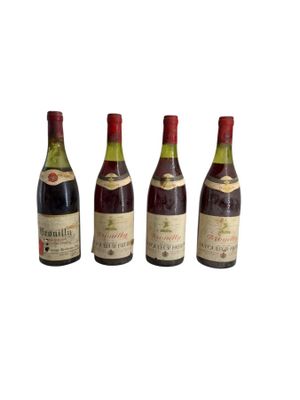 three bottles of wine sit next to each other on a white surface