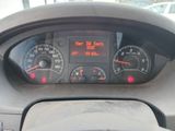 a car dashboard with a speedometer and gauges on it