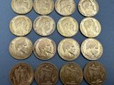 a close up of a bunch of coins sitting on top of a table