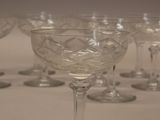 several empty wine glasses are lined up on a table