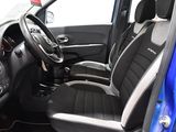 the interior of a small blue car with black seats and a steering wheel