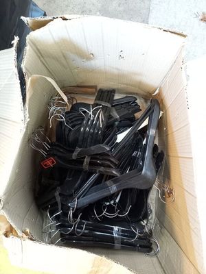 a cardboard box full of forks and spoons in it