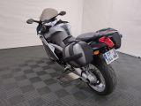 a motorcycle that is parked on a black and white checkered floor