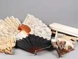 many different types of paper fans on the table