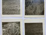 four old black and white photos of a city and mountains