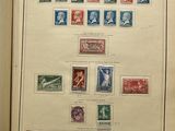an open book with a bunch of different stamps on it