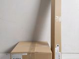 an open box sitting on top of a white floor next to a cardboard box