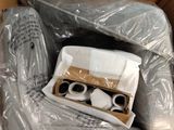 a cardboard box with a pair of scissors inside of it