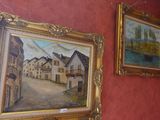 painting on the wall of a room with paintings hanging on the wall