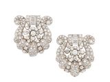 a pair of diamond and white gold earrings