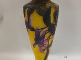 an image of a lamp with a yellow shade on top of it