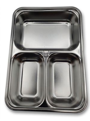a close up of a metal tray with three compartments on a white background