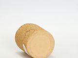 a close up of a wine cork on a white surface