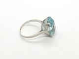 an image of a ring with a blue topazr stone