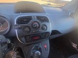 dashboard view of a car with a person sitting in the driver ' s seat
