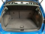 the back of a blue car with its trunk open showing the cargo area