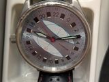 a close up of a watch in a box